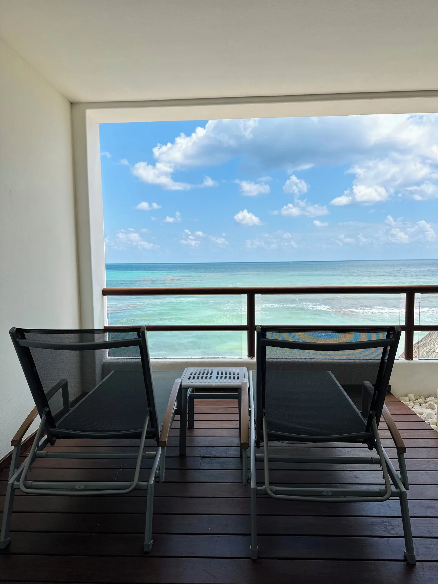 Balcony seating facing the Caribbean Sea at Senses Riviera Maya Oceanfront.
