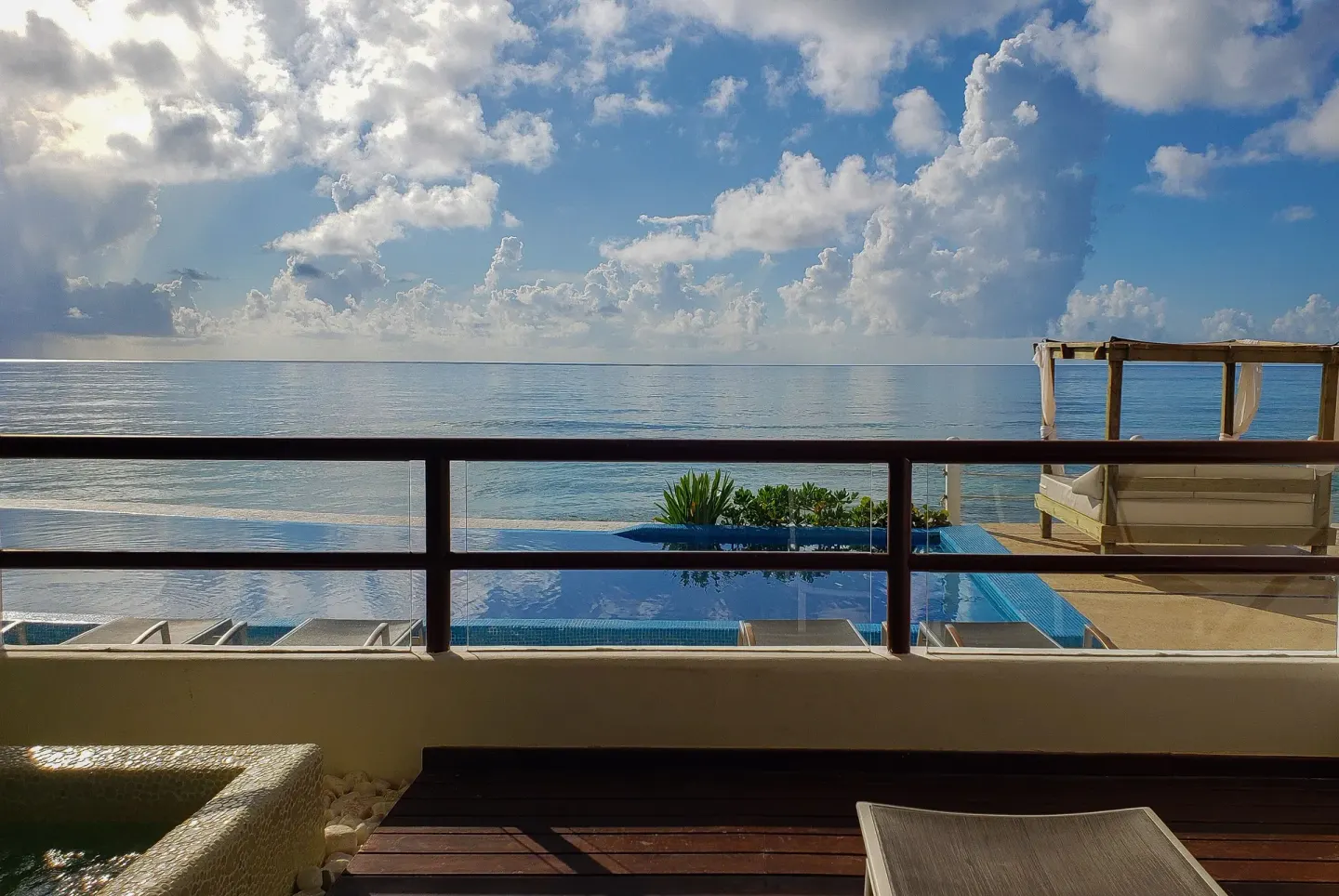 Balcony with pool and ocean view at Senses Riviera Maya Oceanfront.