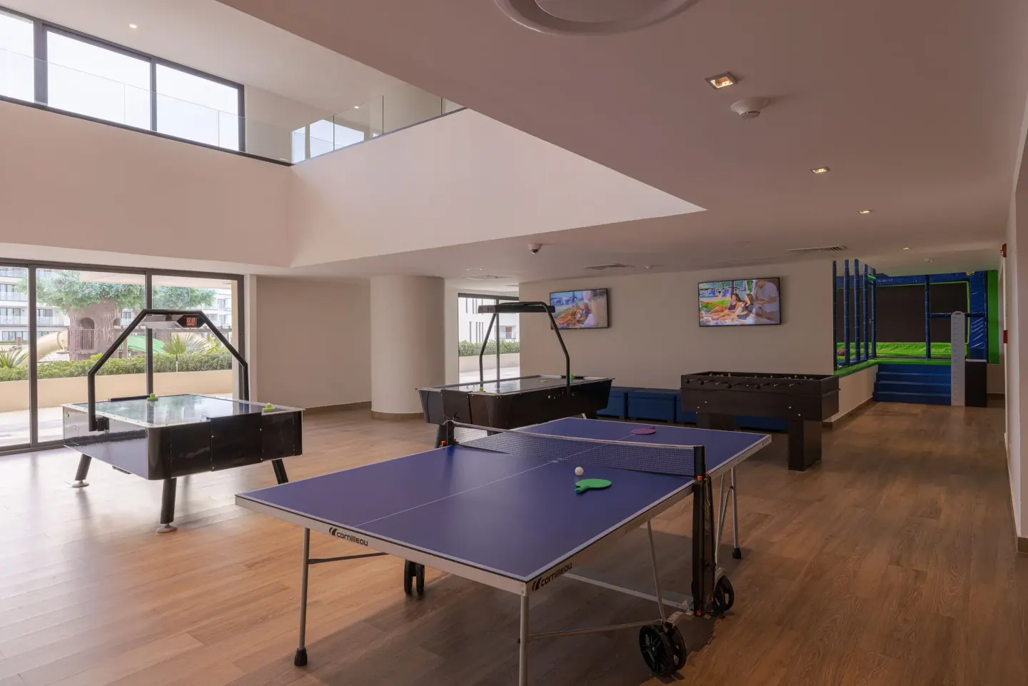 Indoor game room with ping pong, air hockey, foosball and trampoline at Sensira Resort & Spa Riviera Maya.