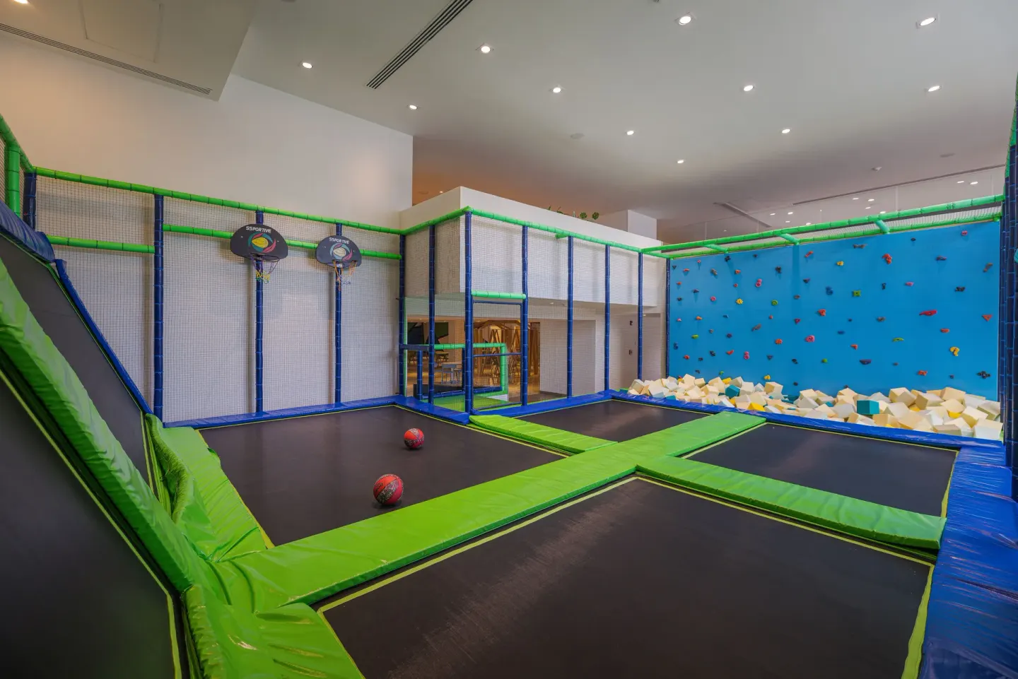 Indoor trampoline area with climbing wall at Sensira Resort & Spa Riviera Maya.