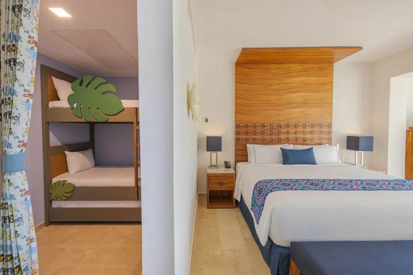 Sapphire Room king bed and bunk beds at Sensira Resort & Spa Riviera Maya.