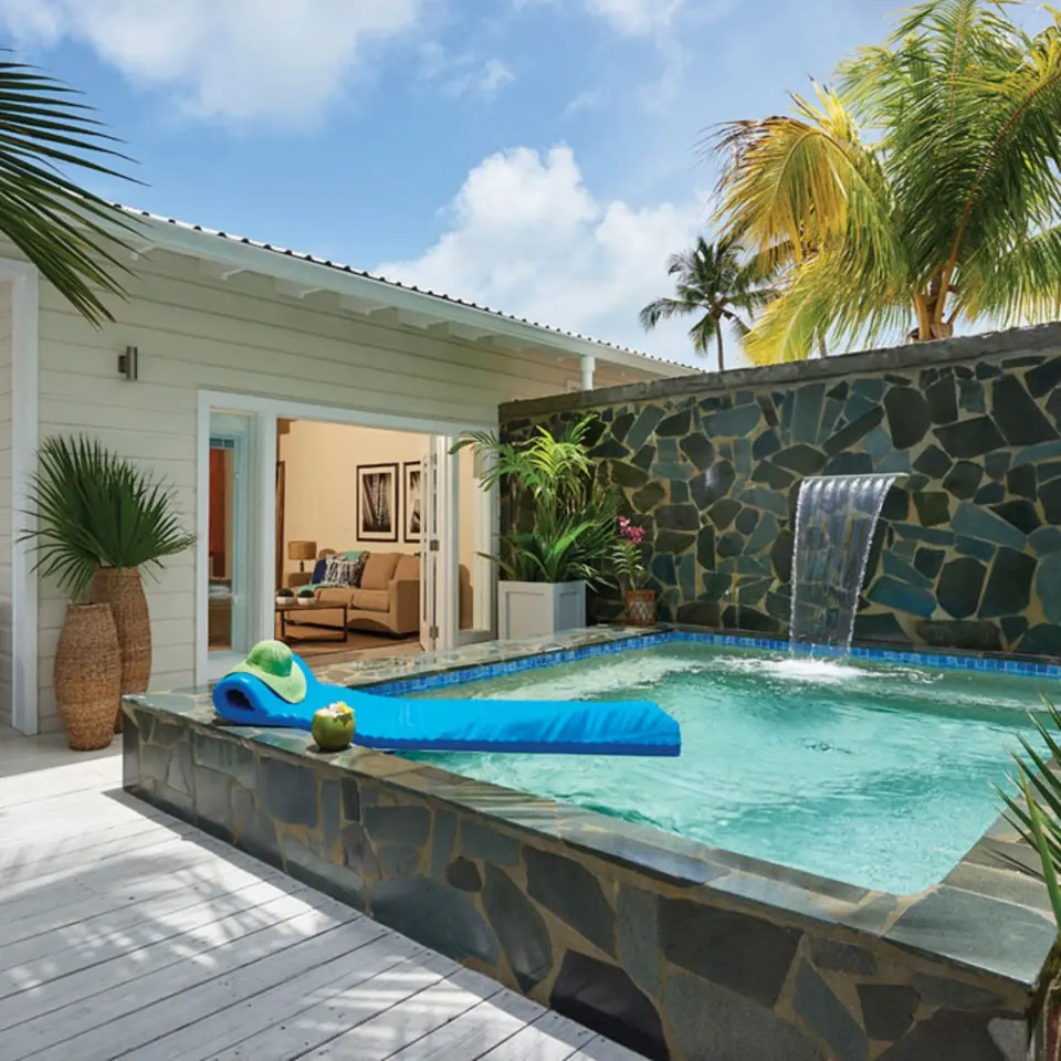Private plunge pool with waterfall feature and patio view of suite at Serenity At Coconut Bay