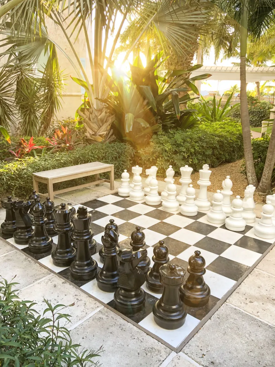 Oversized outdoor chessboard in a tropical garden at Seven Stars Resort & Spa.