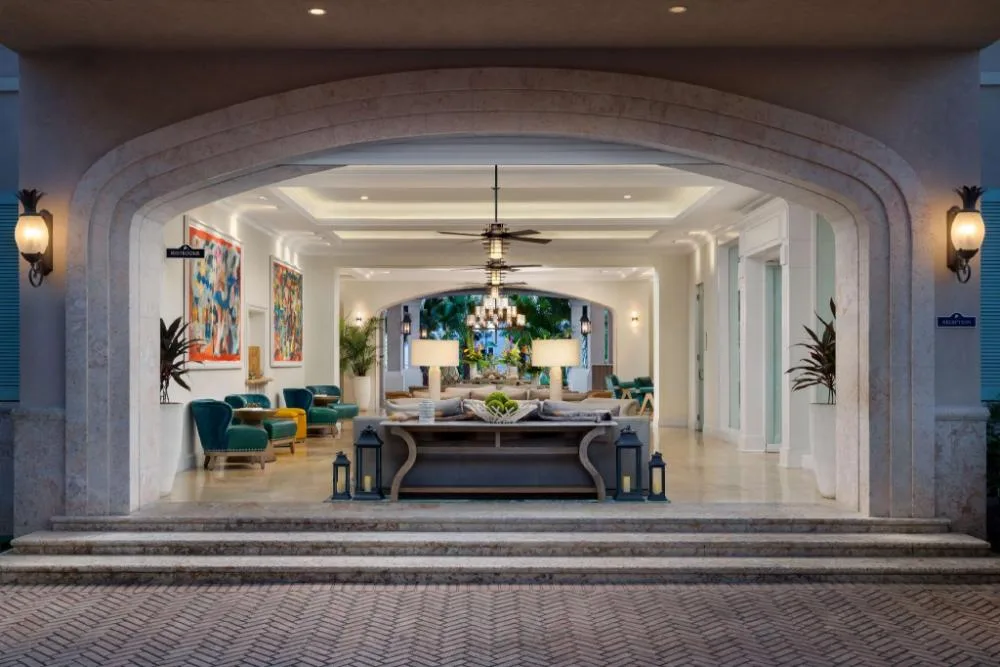 Open-air lobby entrance with arched stonework and lounge seating at Seven Stars Resort & Spa.