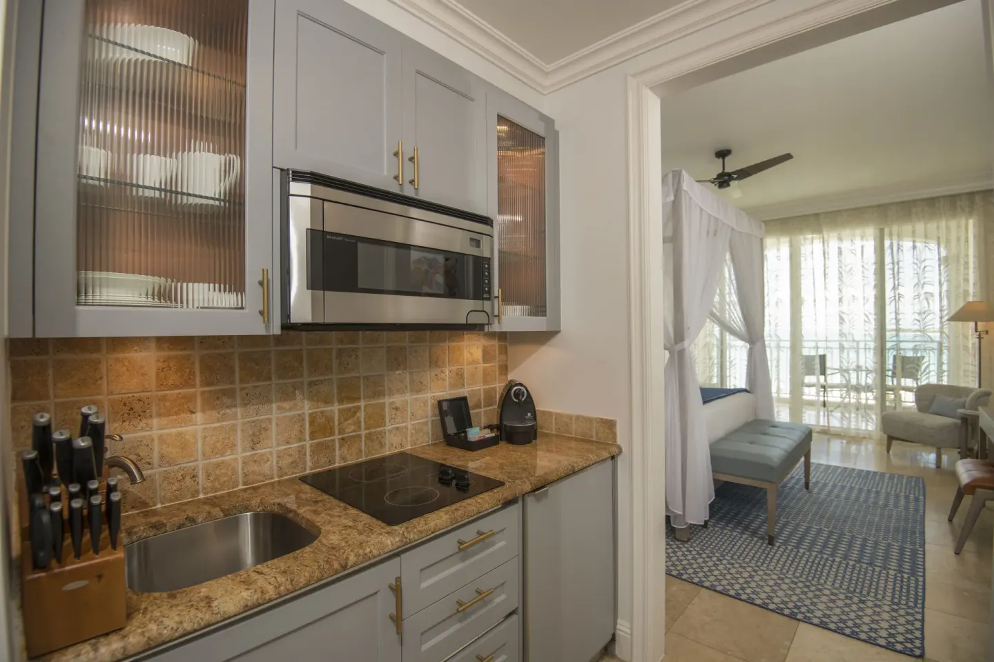 Junior Suite Oceanfront kitchenette beside the bedroom at Seven Stars Resort & Spa.