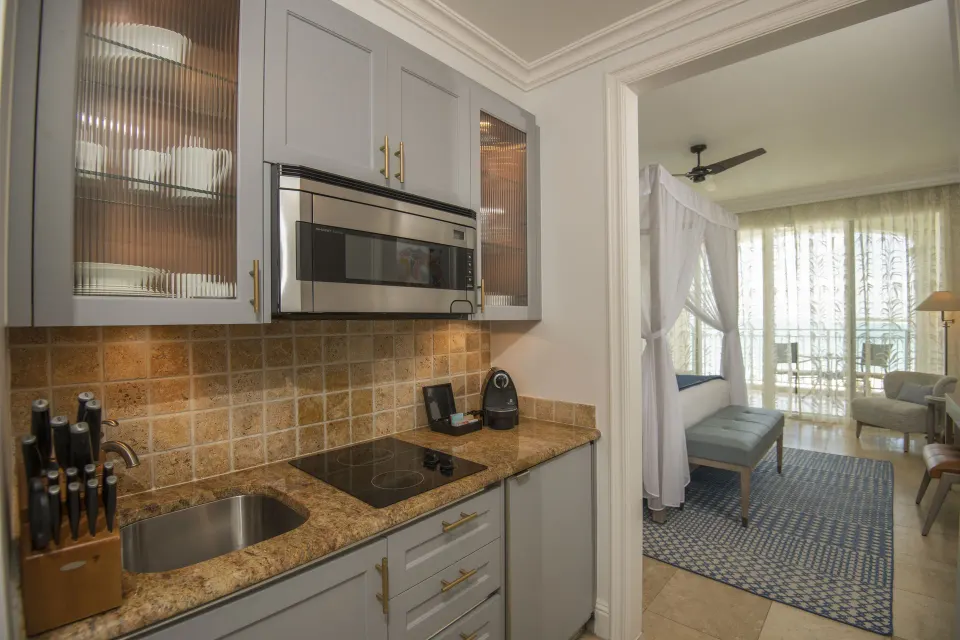Junior Suite Oceanfront kitchenette beside the bedroom at Seven Stars Resort & Spa.