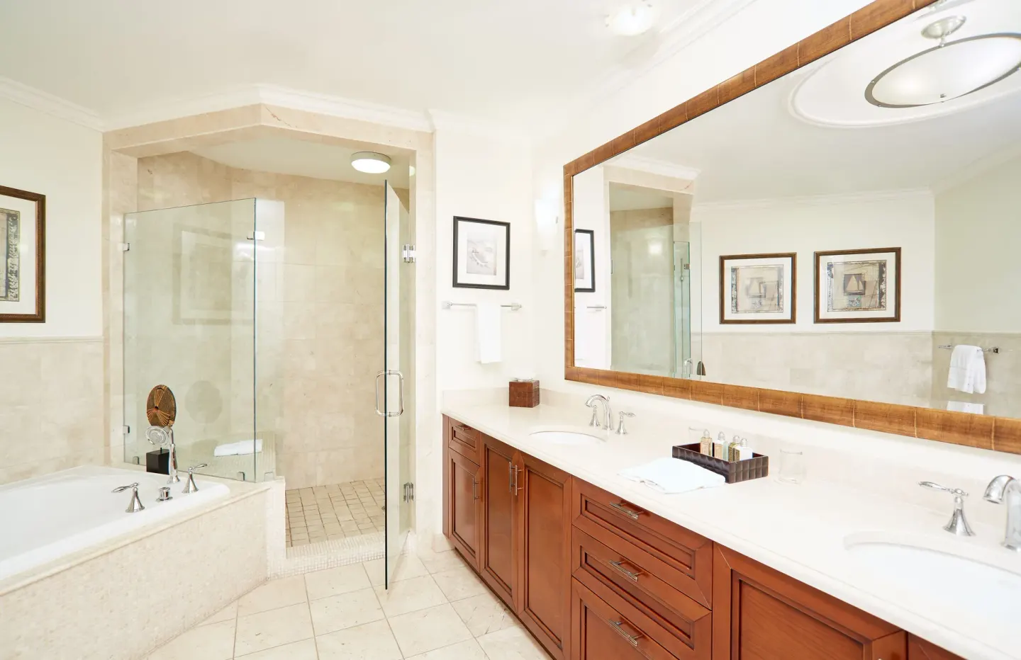 One Bedroom Island View suite bathroom with tub, shower, and double vanity at Seven Stars Resort & Spa.