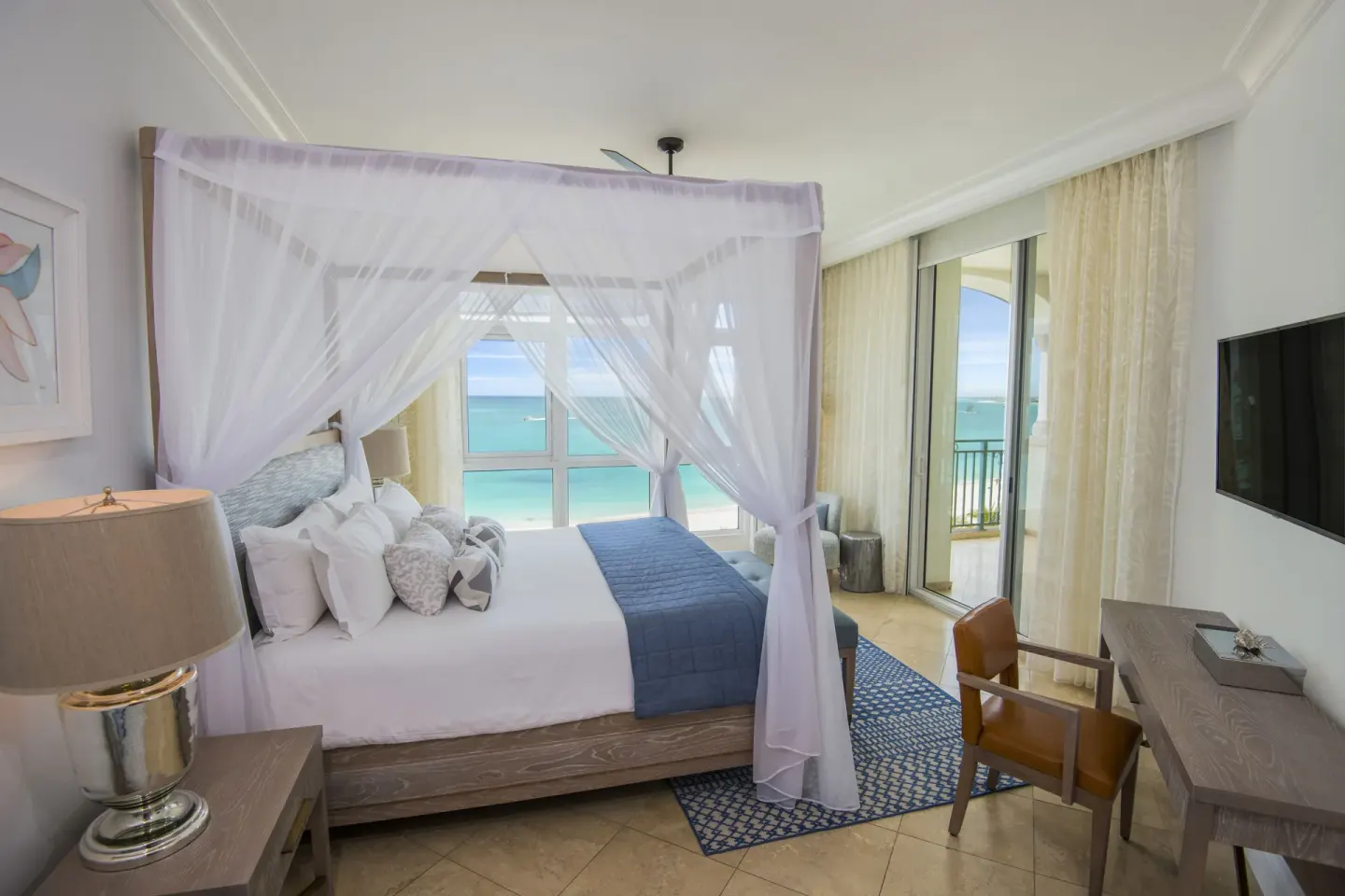 Ocean-view one-bedroom suite with canopy bed at Seven Stars Resort & Spa.