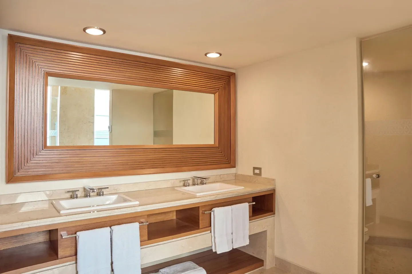 Double-sink bathroom vanity with large framed mirror at Sheraton Buganvilias Puerto Vallarta.