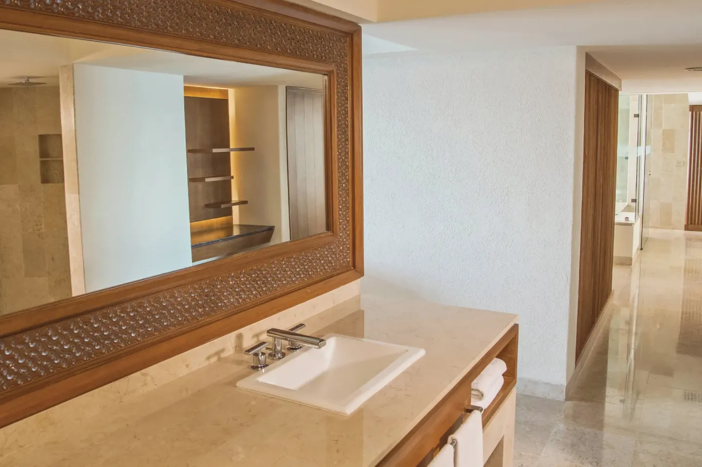Guest room vanity with carved mirror at Sheraton Buganvilias Puerto Vallarta.