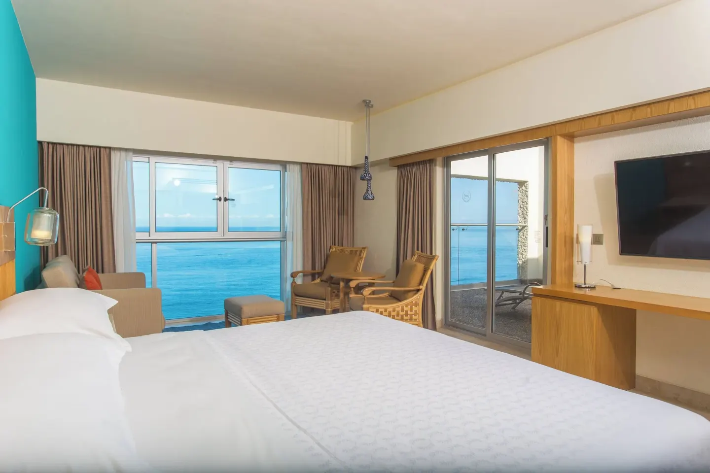 Ocean view king guest room with balcony access at Sheraton Buganvilias Puerto Vallarta.