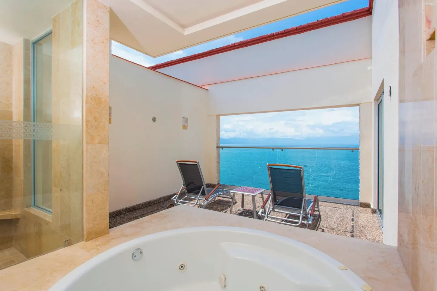 Private terrace with whirlpool tub and ocean view at Sheraton Buganvilias Puerto Vallarta.
