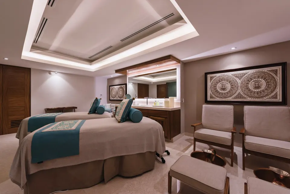 Spa treatment room with two massage tables at Sheraton Buganvilias Puerto Vallarta.
