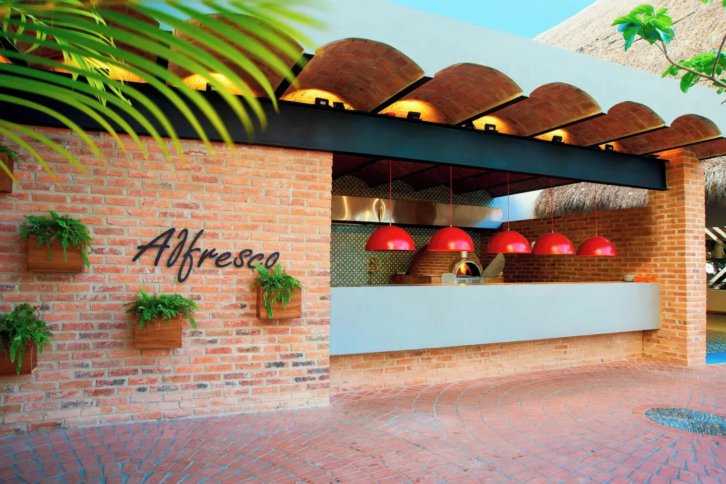 Alfresco brick pizza counter and open kitchen at Sheraton Buganvilias Puerto Vallarta.