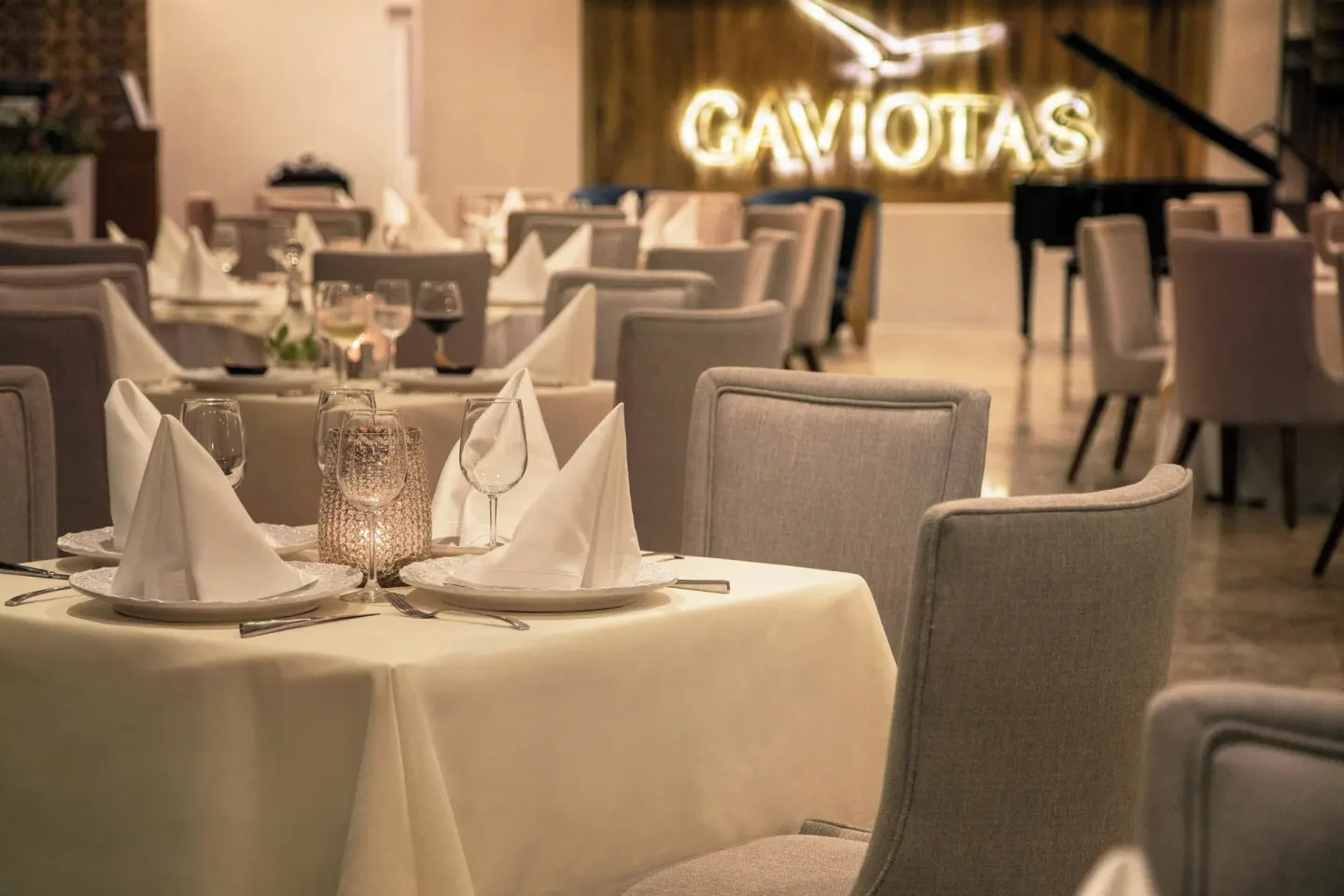 Gaviotas dining room with set tables at Sheraton Buganvilias Puerto Vallarta.