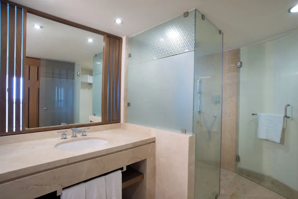 Deluxe Garden View bathroom with glass shower at Sheraton Buganvilias Puerto Vallarta.