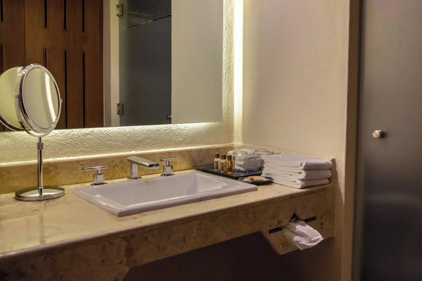 Deluxe Garden View room vanity with towels at Sheraton Buganvilias Puerto Vallarta.