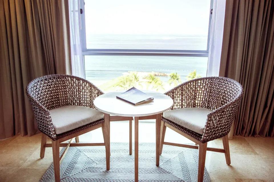 Ocean-view seating area in a Deluxe Room at Sheraton Buganvilias Puerto Vallarta.