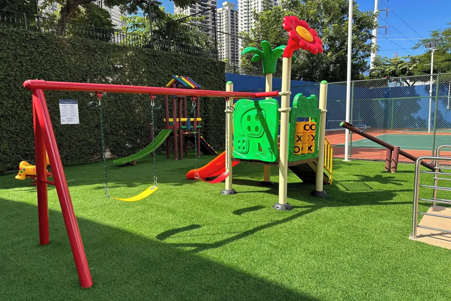 Outdoor playground with swings, slides, and play structures at Sheraton Grand Panama.