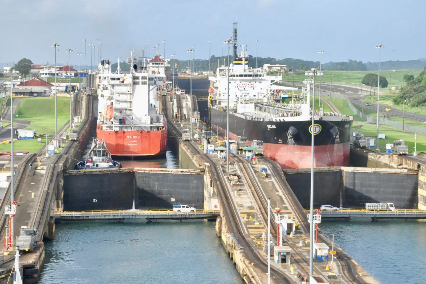 Cargo ships pass through the Panama Canal near Sheraton Grand Panama.