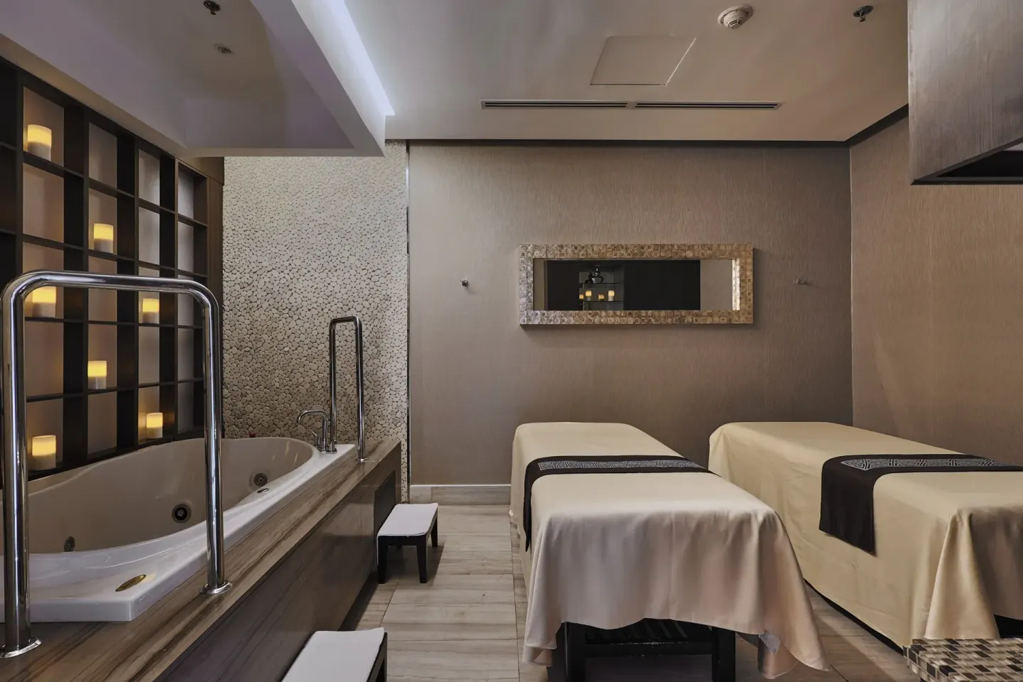 Spa suite with two treatment beds and a soaking tub at Sheraton Grand Panama.