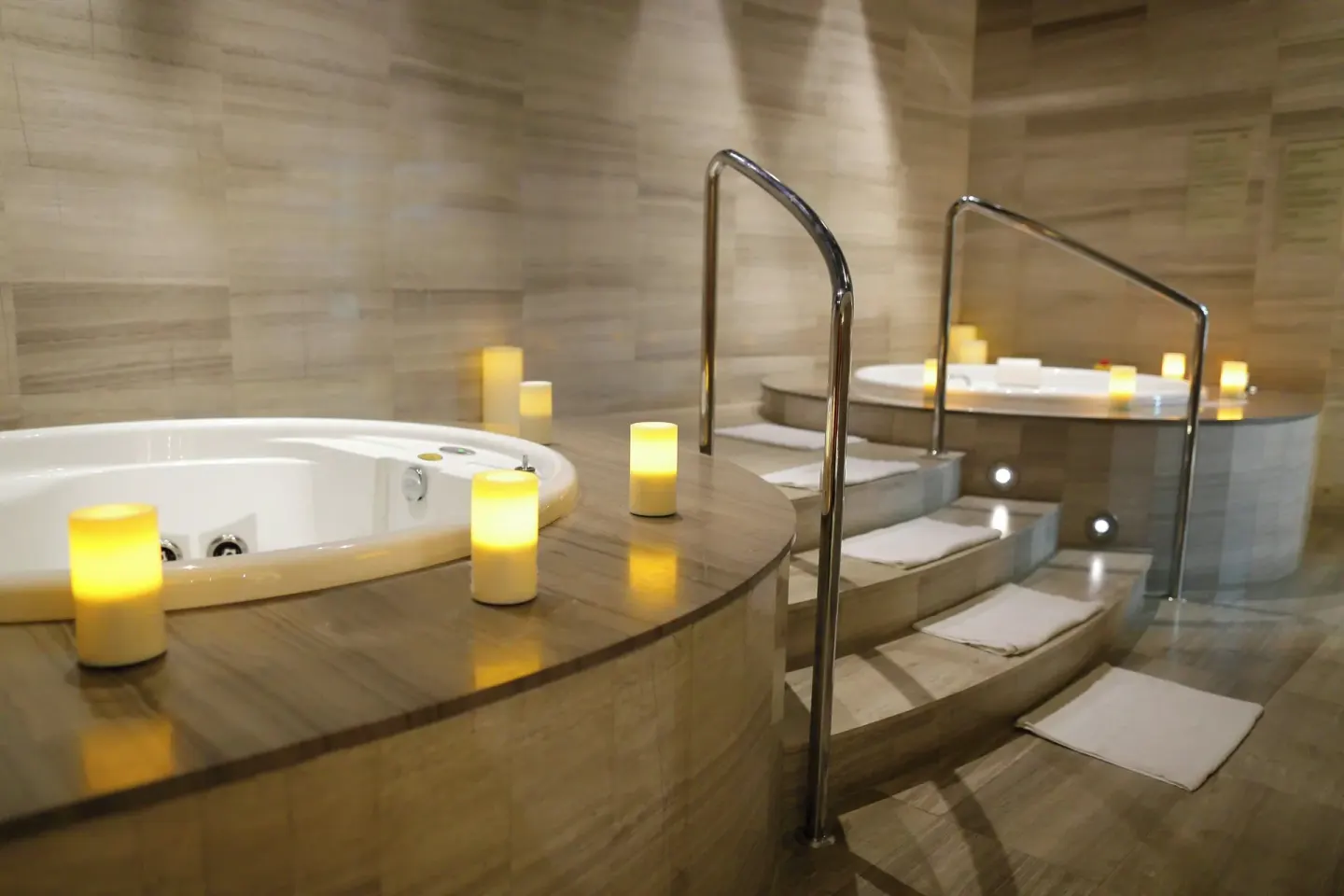 Spa whirlpool tubs with candles and steps at Sheraton Grand Panama.