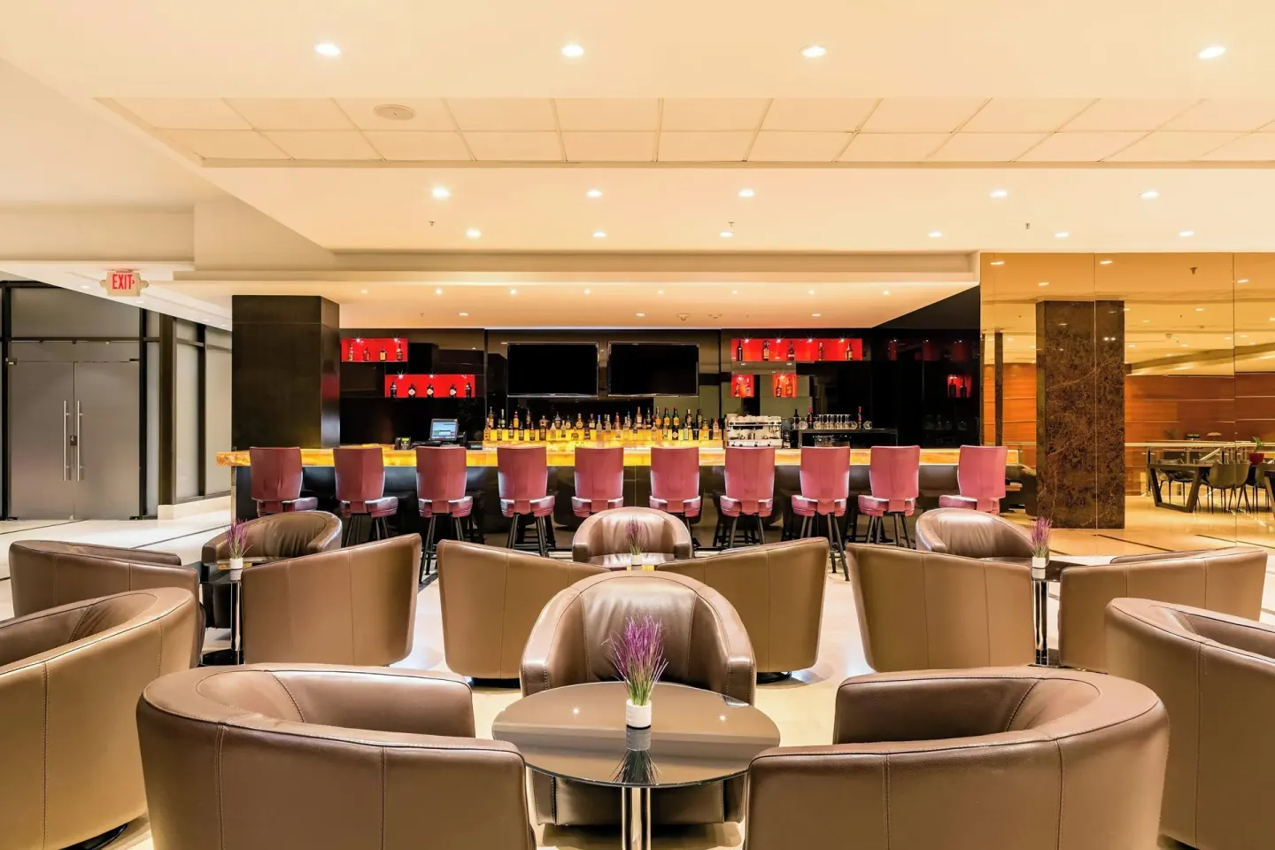 Lobby bar seating with a long counter and lounge chairs at Sheraton Grand Panama.