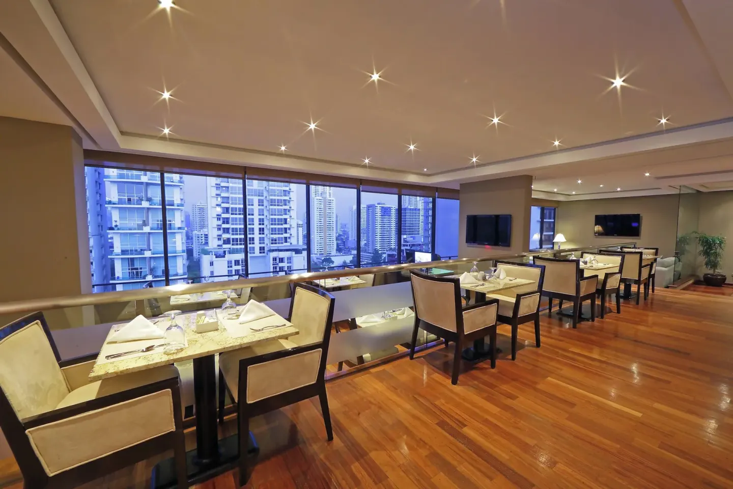 Club lounge dining area with city views at Sheraton Grand Panama.