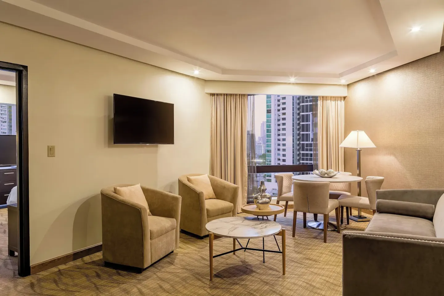 Executive Suite living room with city view at Sheraton Grand Panama.