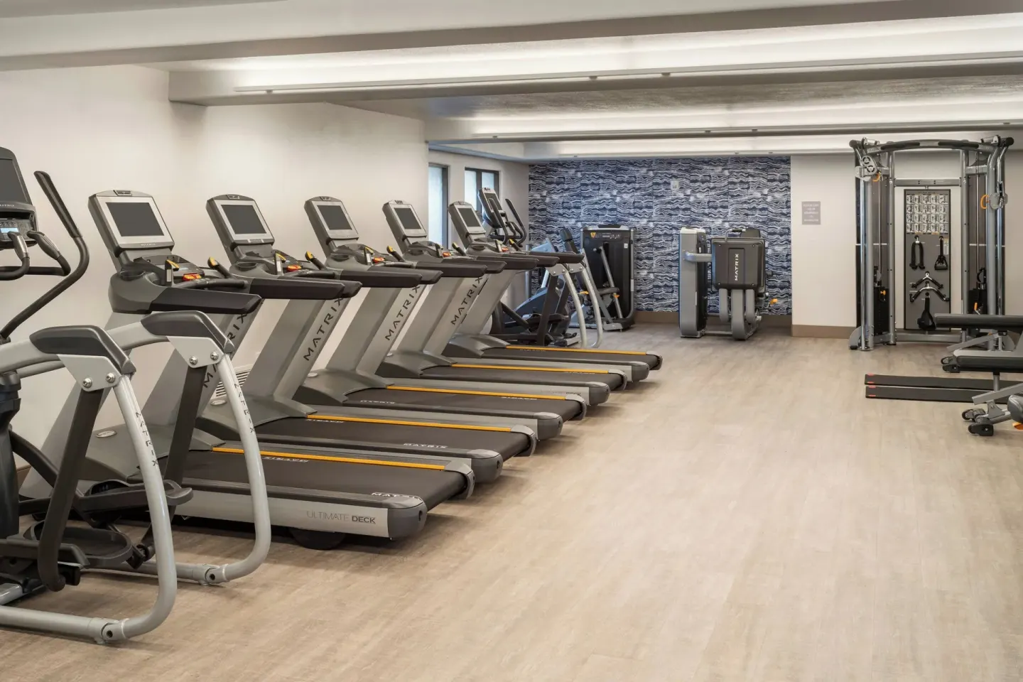 Fitness center with treadmills and strength machines at Sheraton Kauai Coconut Beach Resort.
