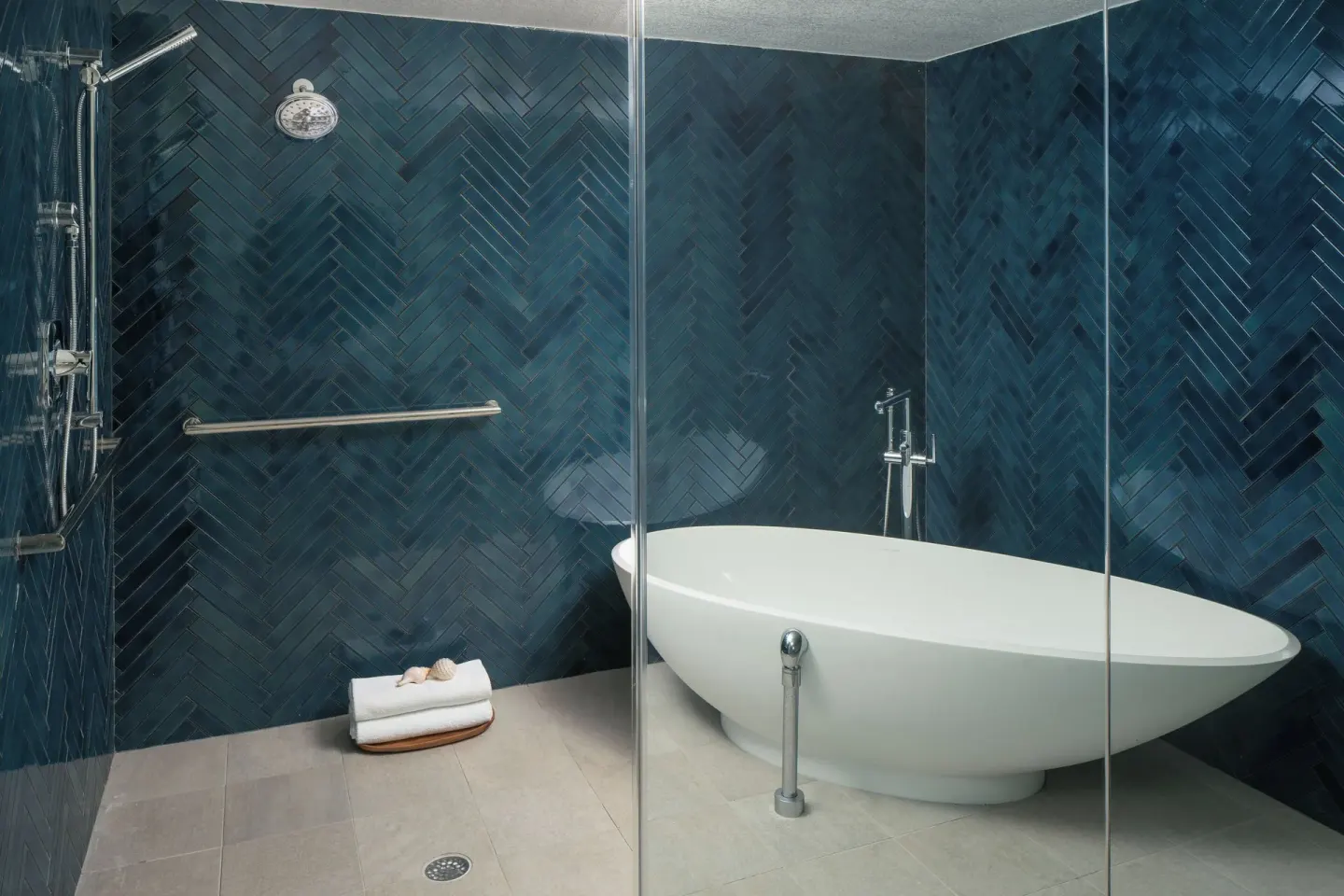 Guest bathroom with soaking tub and shower at Sheraton Kauai Coconut Beach Resort.