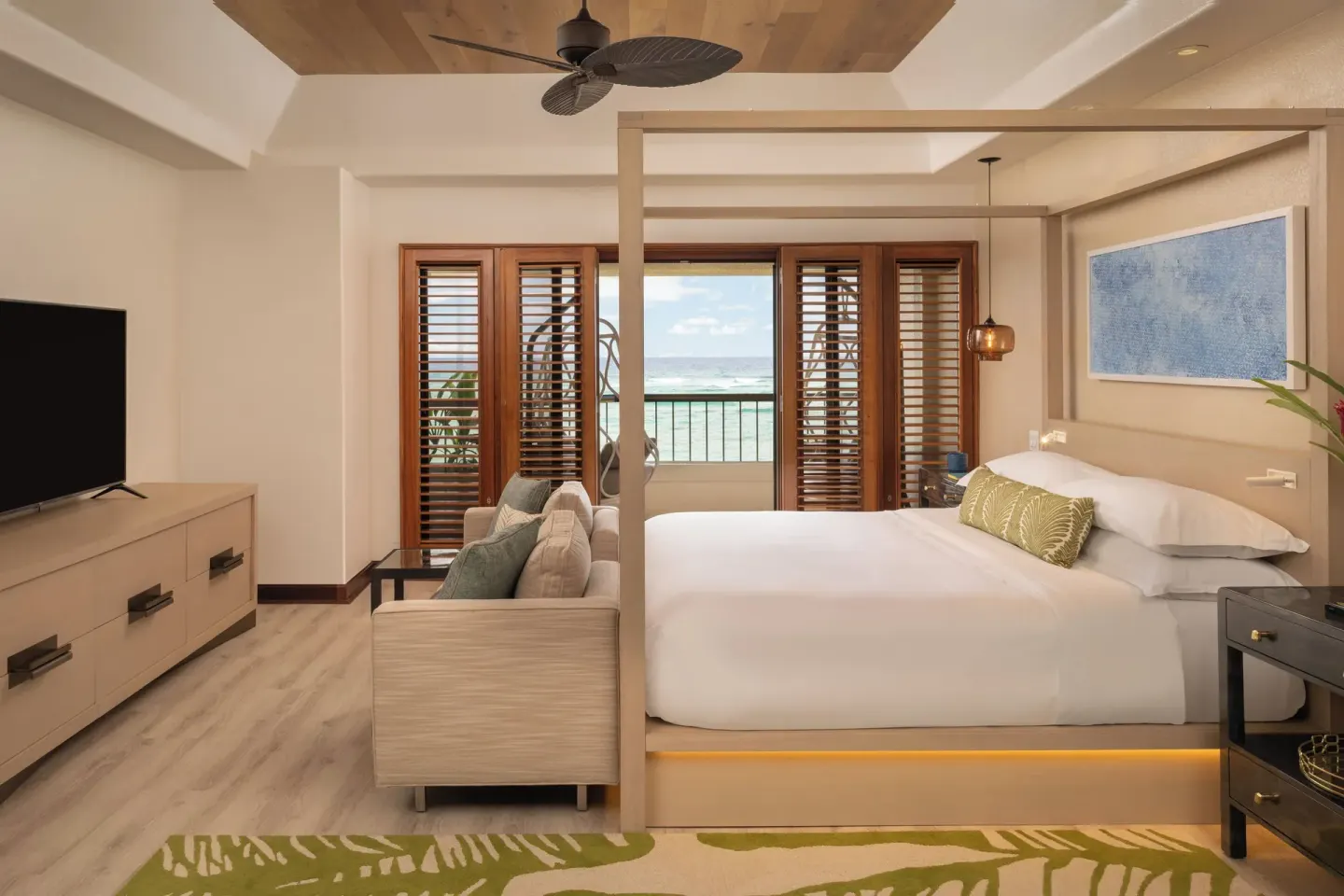 King bed suite with ocean view at Sheraton Kauai Coconut Beach Resort.