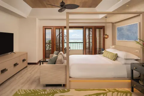 King bed suite with ocean view at Sheraton Kauai Coconut Beach Resort.