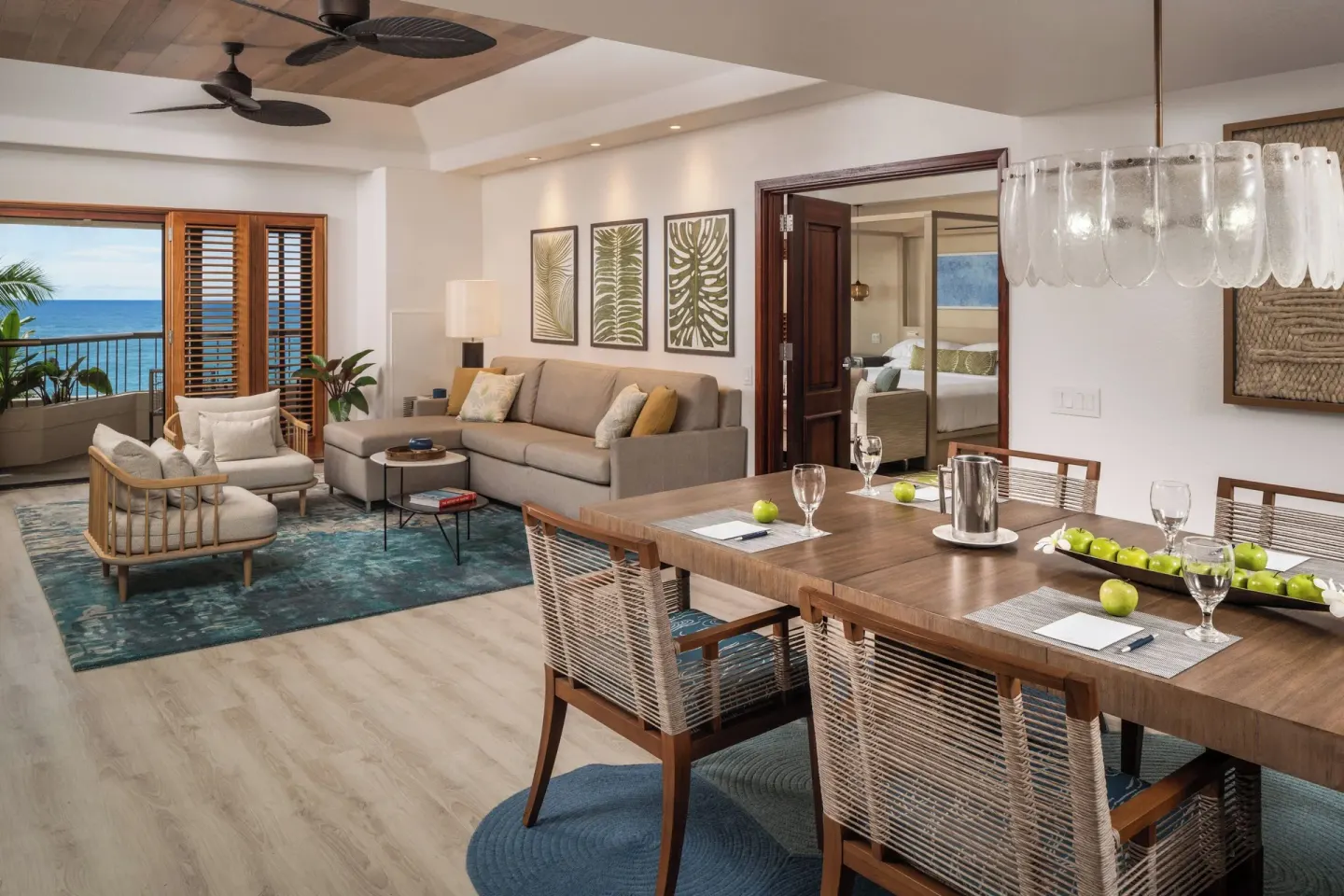 Suite living and dining area with ocean view at Sheraton Kauai Coconut Beach Resort.