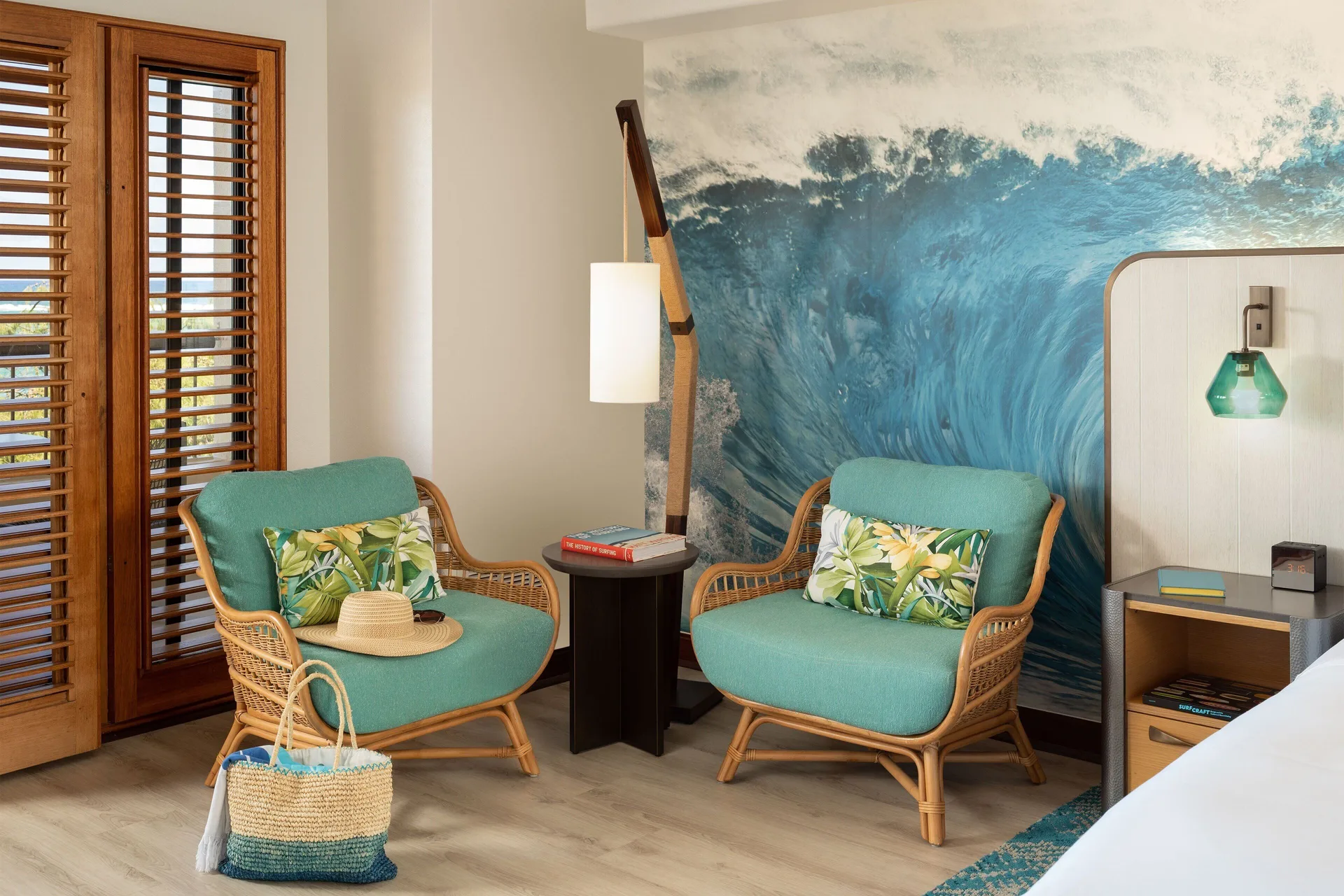 Guest room seating area with wave mural at Sheraton Kauai Coconut Beach Resort.