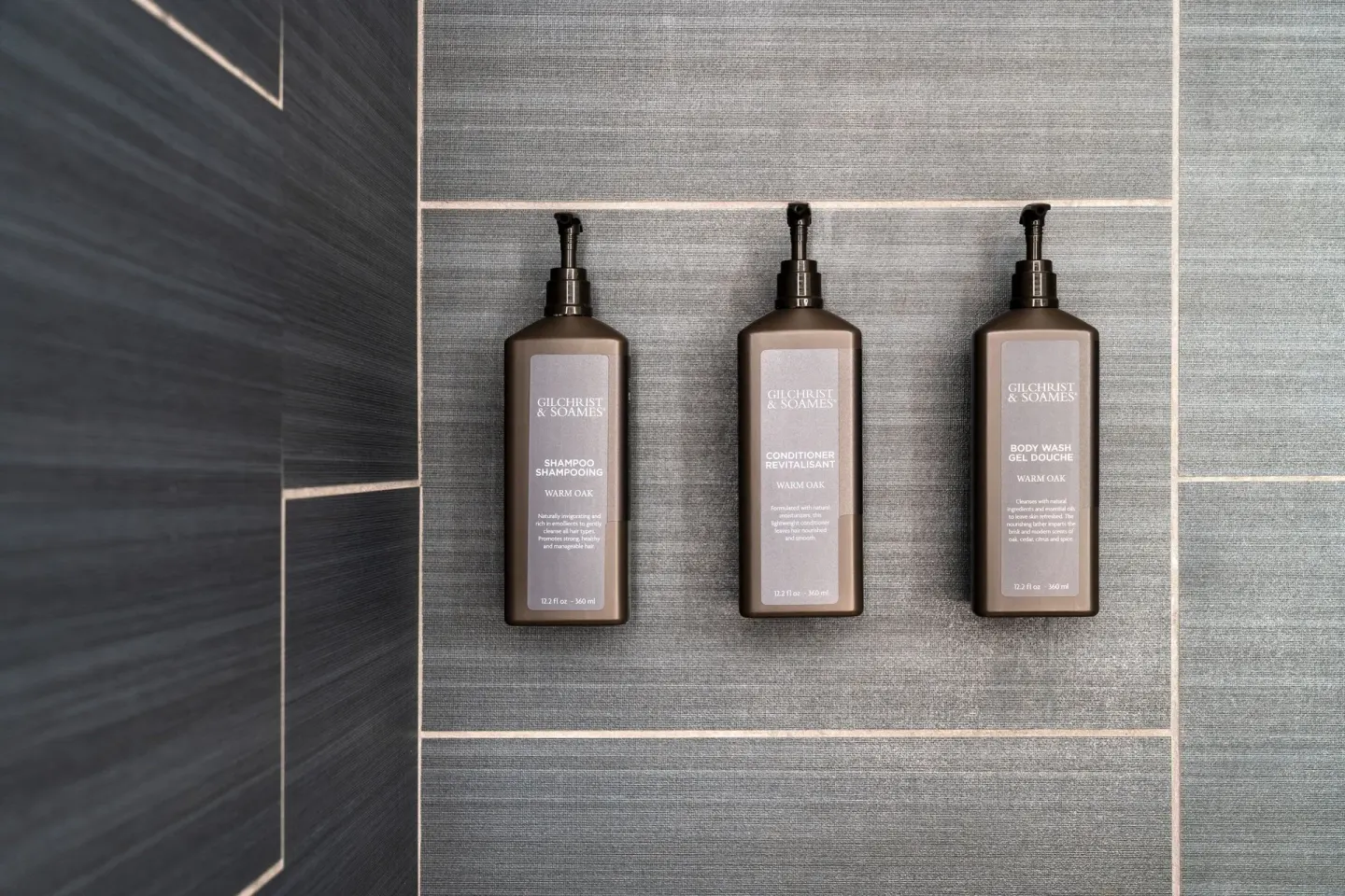 Guest room shower amenities mounted on tile at Sheraton Kauai Coconut Beach Resort.