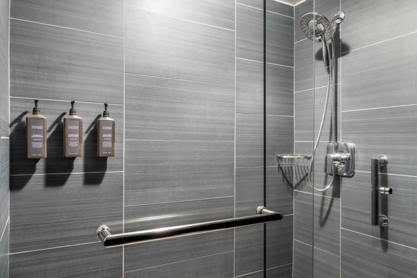 Standard Room glass shower with gray tile at Sheraton Kauai Coconut Beach Resort.