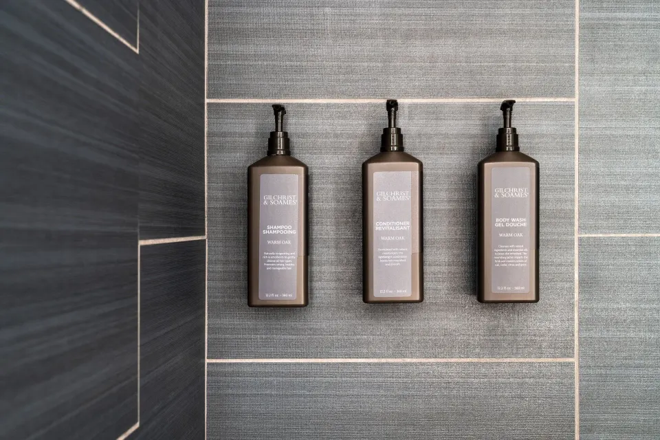Wall-mounted shower amenities in a standard room at Sheraton Kauai Coconut Beach Resort.