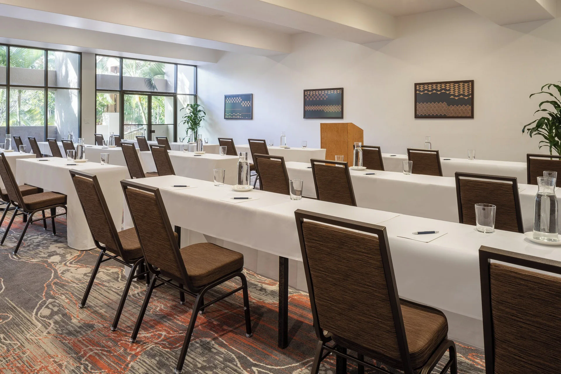 Classroom-style meeting room with white-draped tables at Sheraton Kauai Coconut Beach Resort.