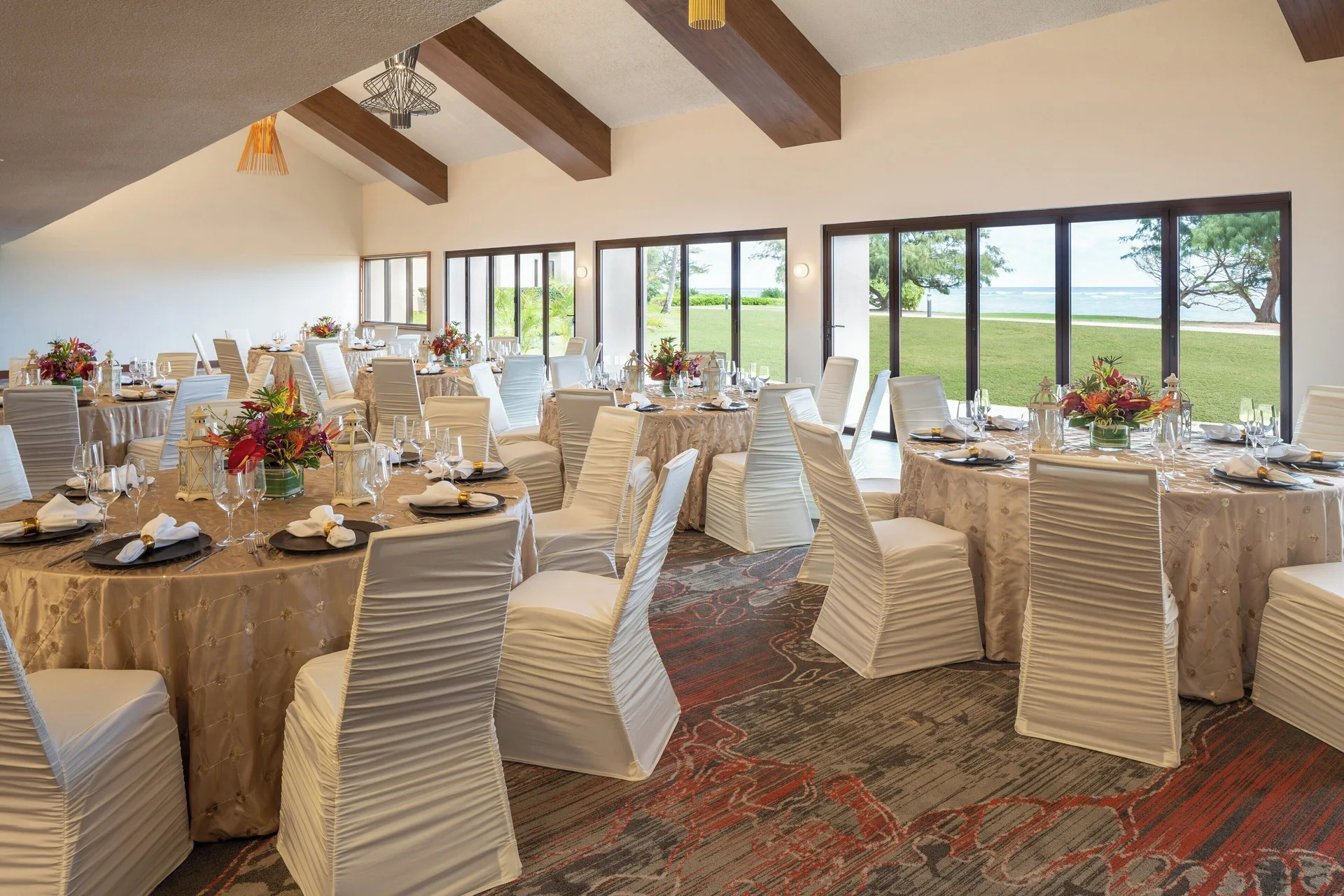 Indoor banquet room with ocean-view windows at Sheraton Kauai Coconut Beach Resort.