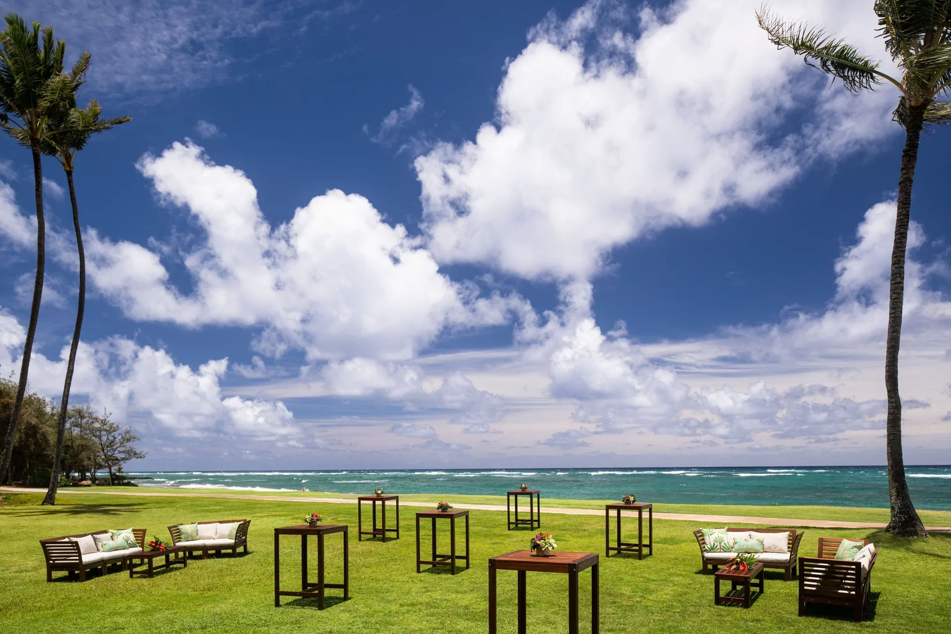Oceanfront lawn event seating at Sheraton Kauai Coconut Beach Resort.
