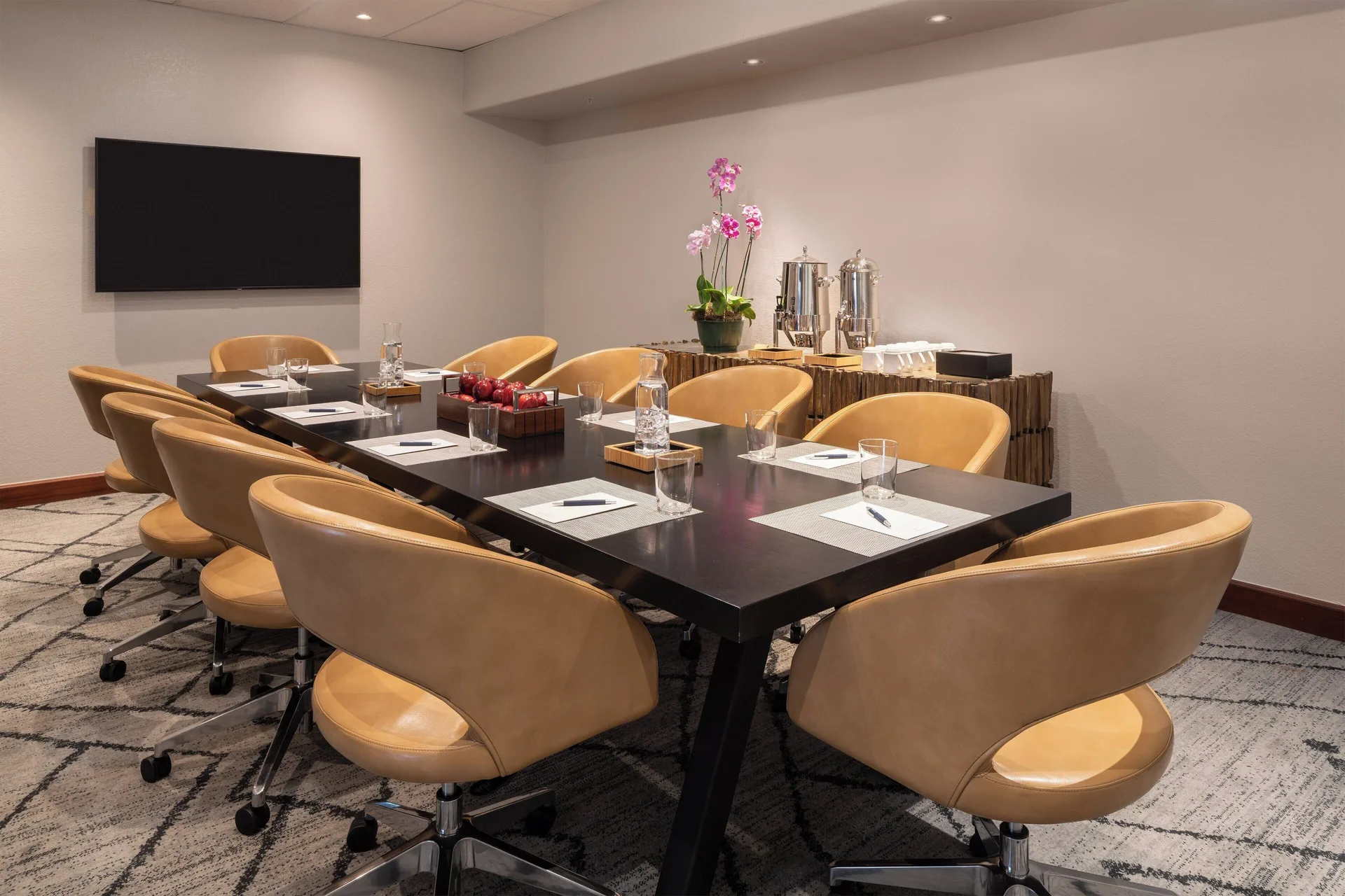 Boardroom table with tan chairs and coffee service at Sheraton Kauai Coconut Beach Resort.