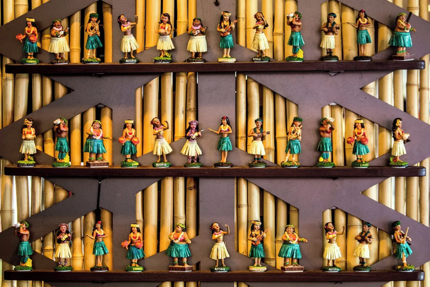Rows of hula figurines displayed on shelves at Sheraton Kauai Resort.
