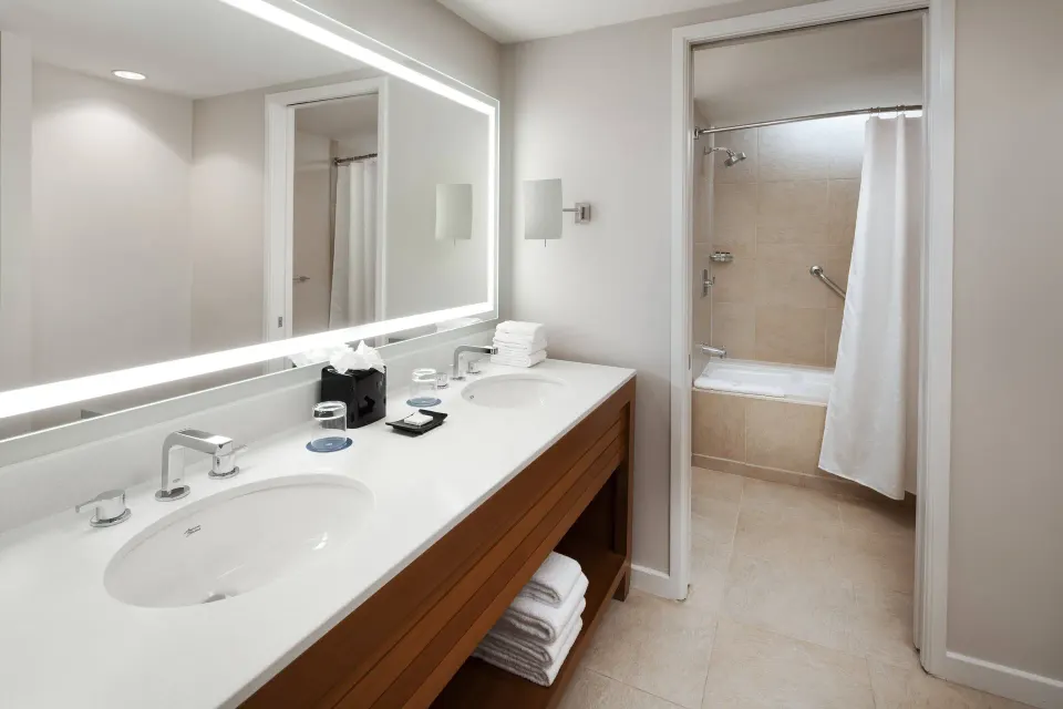 Deluxe Room Garden View bathroom with double vanity at Sheraton Kauai Resort.