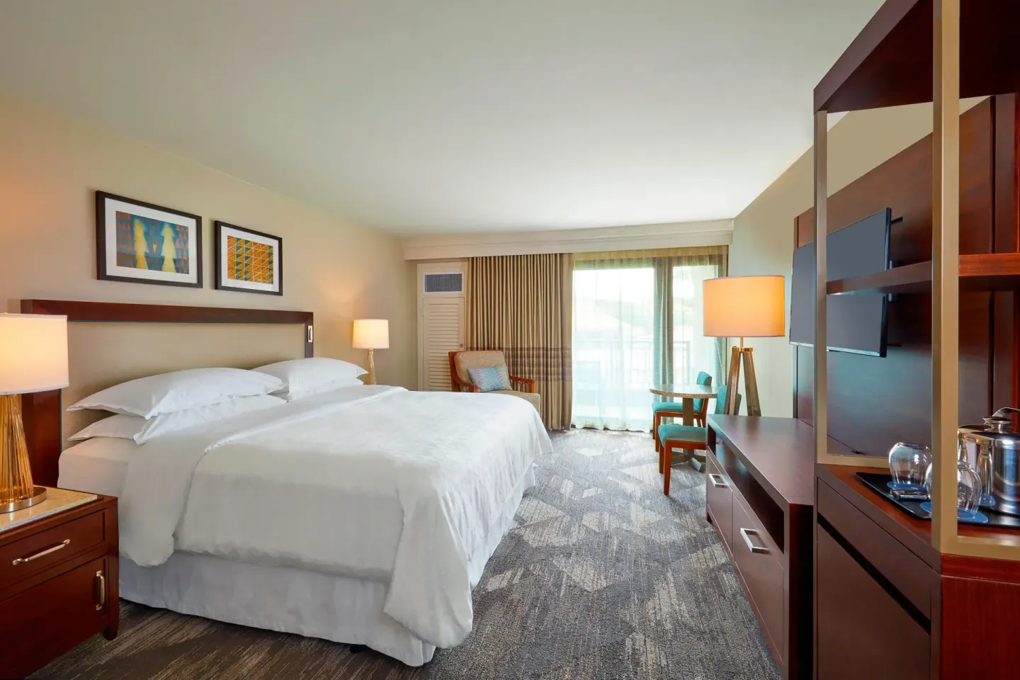 Deluxe Room Garden View king bed with sitting area at Sheraton Kauai Resort.