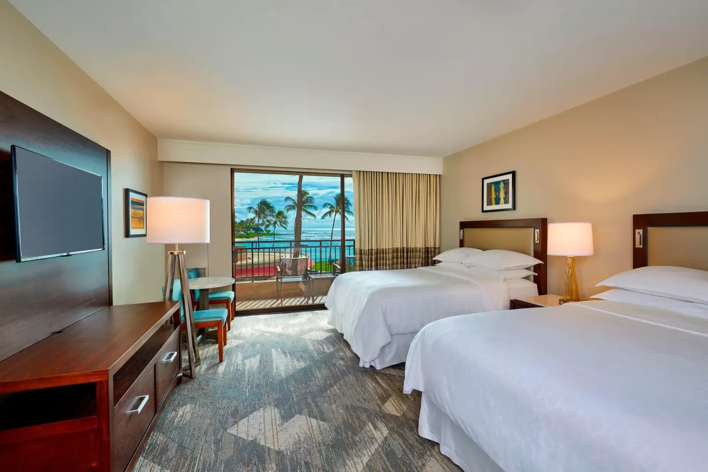 Deluxe Room Oceanfront two beds at Sheraton Kauai Resort with balcony and ocean view.