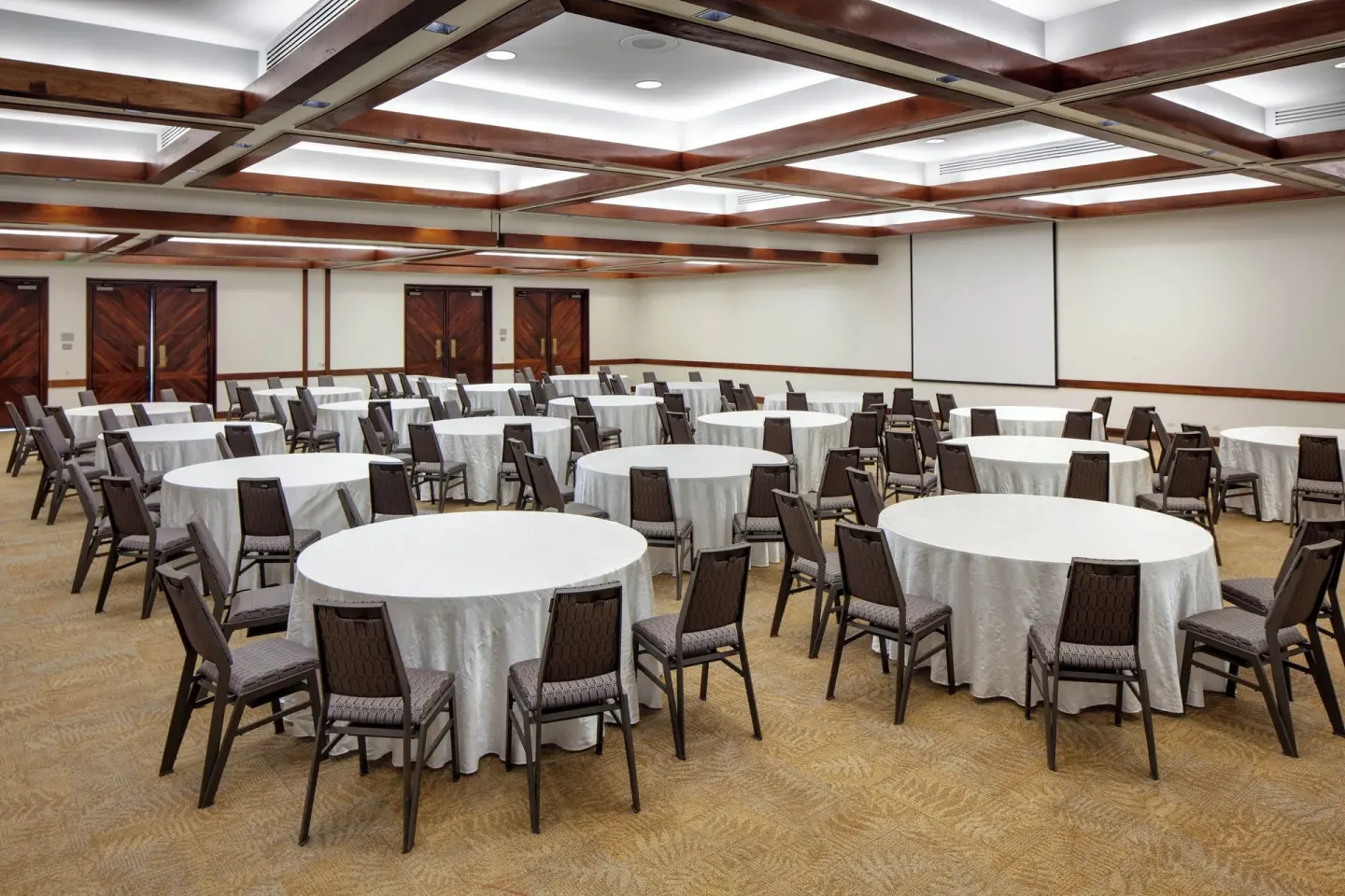 Ballroom set with round banquet tables and chairs at Sheraton Kauai Resort.