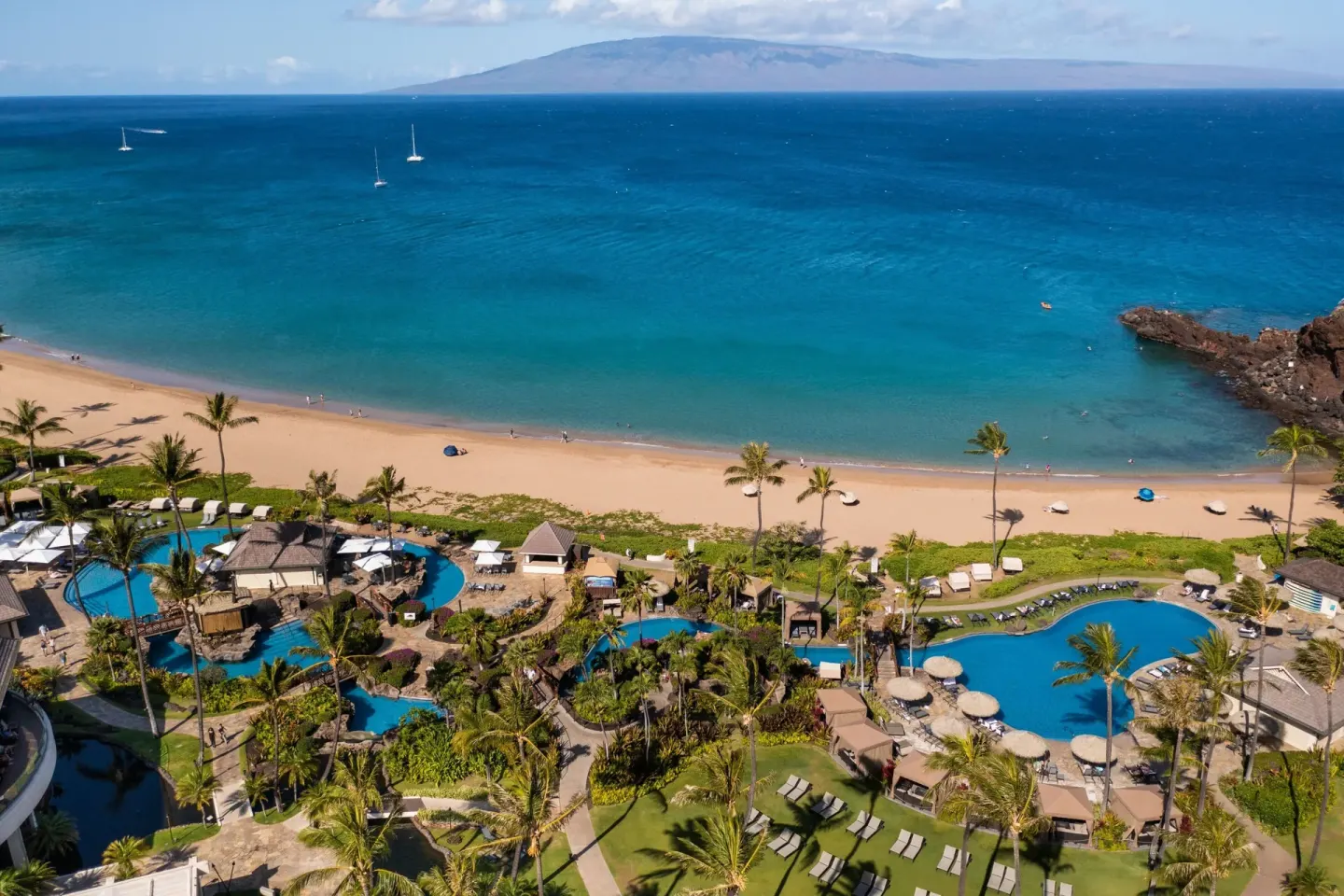 Aerial view of the beach, pools, and ocean at Sheraton Maui Resort & Spa.