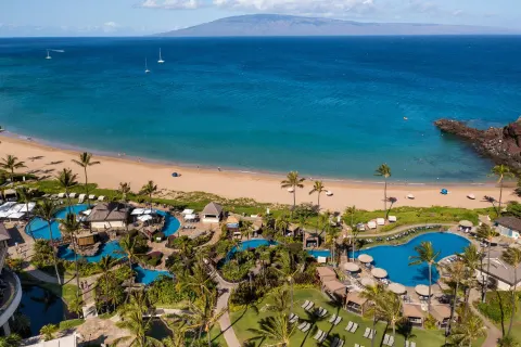 Aerial view of the beach, pools, and ocean at Sheraton Maui Resort & Spa.