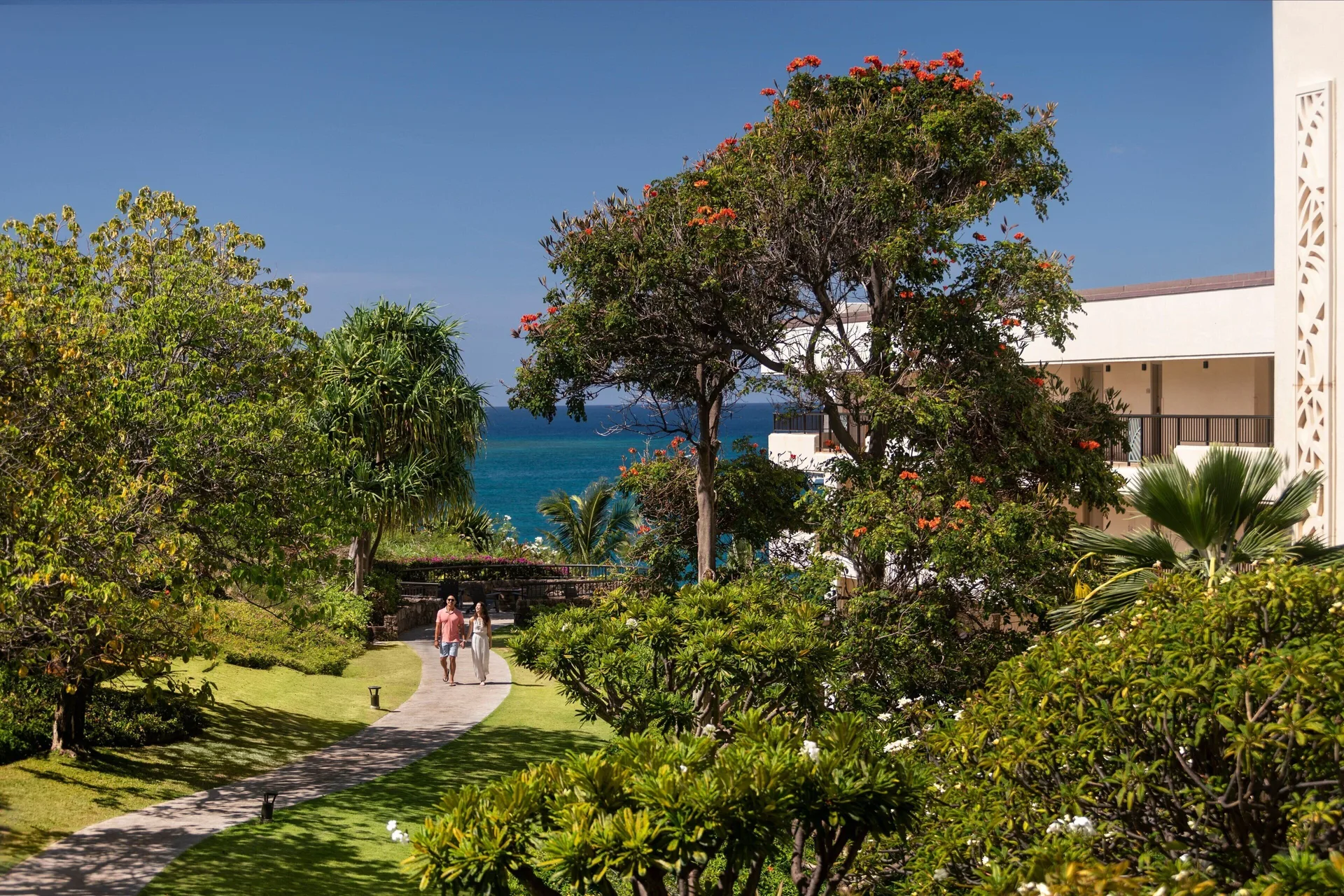 Garden walkway with ocean glimpses at Sheraton Maui Resort & Spa.